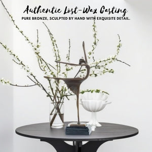 Abstract bronze ballerina sculpture showcasing authentic lost-wax casting craftsmanship with plant decor