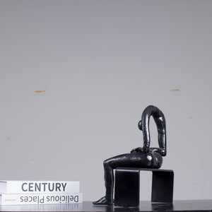 Albert György melancholy man bronze sculpture black finish back view detail
