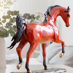 Arabian horse bronze sculpture left side view showing full stallion profile and flowing mane