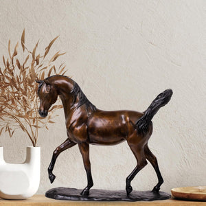 Antique chestnut Arabian stallion bronze sculpture displayed beside dried wheat vase decor