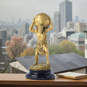 Atlas bronze sculpture gold finish displayed on rooftop city backdrop