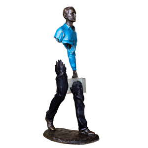 Detailed bronze craftsmanship on the face of the blue jacket traveler statue.