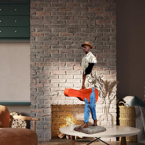 Close-up of the hand-painted blue patina and clothing texture on the fragmented bronze man.