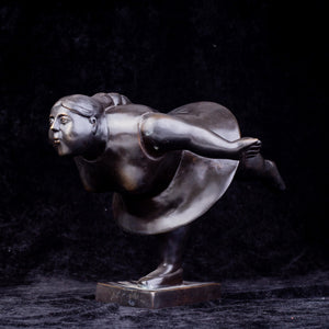 Botero bronze ballerina statue back angle view dark background