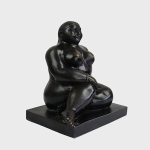 Botero bronze seated woman figurine front close up face and torso detail
