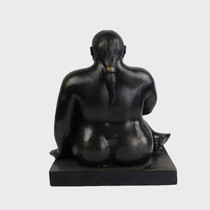 Botero bronze seated woman statue side profile voluptuous body detail