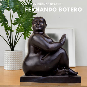 Fernando Botero inspired curvy female bronze sculpture displayed in modern home interior