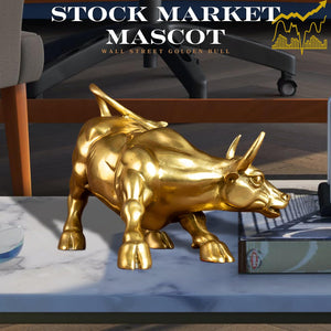 Gold brass bull statue styled on a modern office desk.