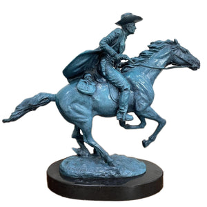 Bronco Buster bronze sculpture with azure blue patina, full view on black marble base