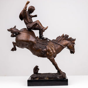 19-inch Frederic Remington Bronco Buster bronze cowboy and horse in dramatic forward-leaning plunge pose