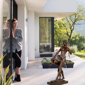 31.5-inch bronze Artemis huntress statue in luxury villa outdoor courtyard setting