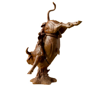 Fine art details of the cowboy's hat and expression on the rodeo bronze statue