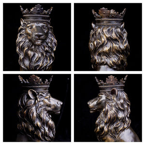 Low front angle view of gold crowned Lion King sovereign sitting sculpture on square base