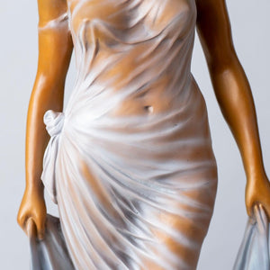 Bronze long haired graceful lady statue waist and dress detail close up craftsmanship