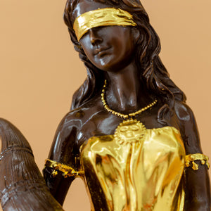 Bronze Fortuna goddess wealth statue 24K gold finish face blindfold detail close up