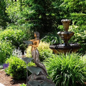 Bronze mermaid garden sculpture estate garden full setting lush landscape display