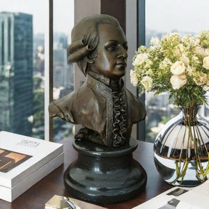 Bronze Mozart bust statue displayed indoors with floral arrangement lifestyle setting