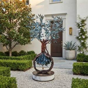 The 1.2-meter-tall handcrafted bronze olive tree and embracing couple sculpture placed at the entrance of a classic luxury American estate, flanked by elegant topiary hedges and potted hydrangeas.