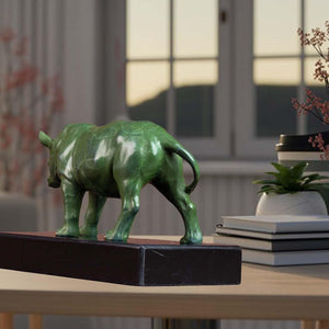 Back view showing craftsmanship of the bronze rhino on black base.