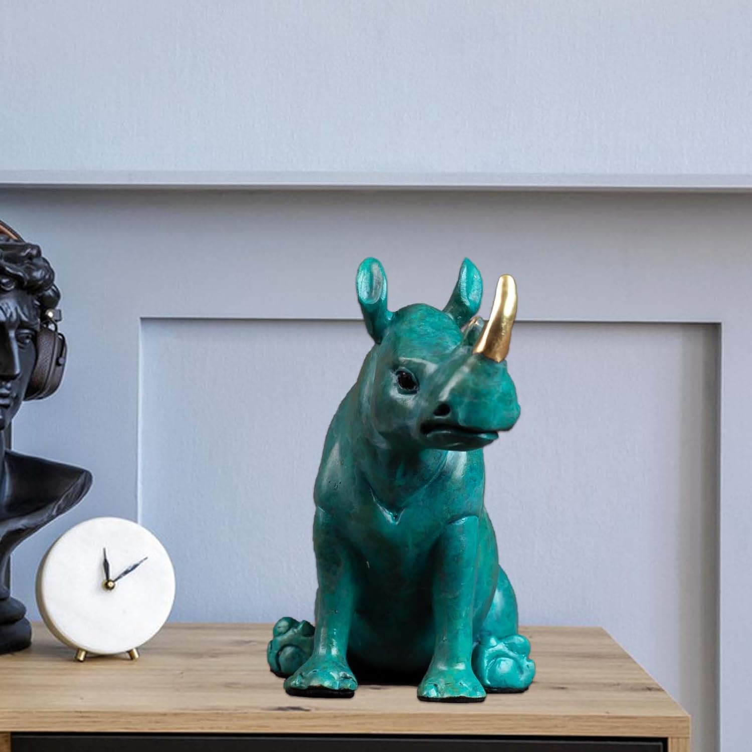 Side view of solid copper rhinoceros statue with unique patina.