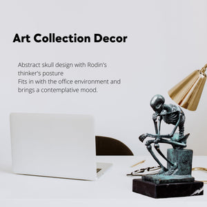 Bronze skeleton Thinker statue in blue-grey finish gift with meaning feature card beside candle