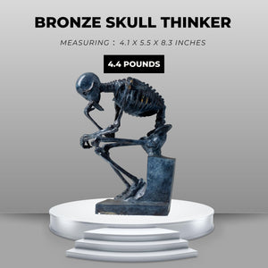 Bronze skeleton Thinker statue in blue-grey patina modern sculpture feature card on pedestal display