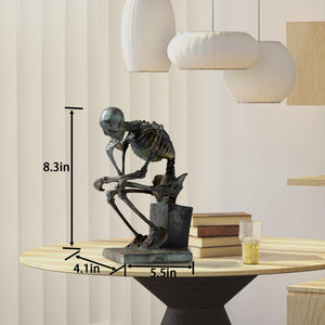 Bronze skeleton Thinker statue in green finish on desk with size dimension reference