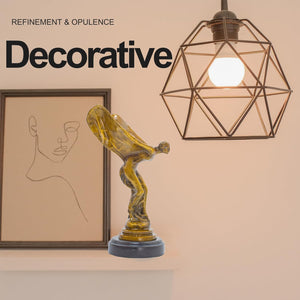 Bronze Spirit of Ecstasy flying lady figurine as decorative art piece in indoor setting with pendant light