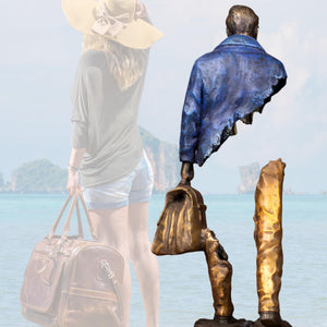 Close-up of the textured bronze base and boots of the standing voyageur statue.