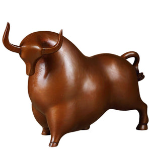 Handcrafted brown bronze charging bull statue with gold accents.