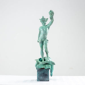 Angled view of Perseus Medusa green bronze sculpture showing mythological figure detail
