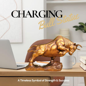 Charging bull sculpture in golden yellow, side angle view.