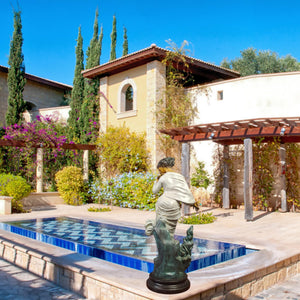 Chione goddess bronze statue placed in luxury garden beside pool as outdoor mythological art decor