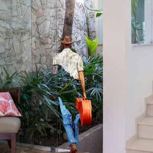 Low-angle view of the large musician bronze sculpture as a luxury contemporary centerpiece.