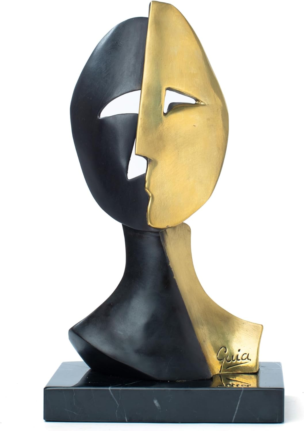 Cubist mask bronze sculpture displayed in indoor setting with fresh floral arrangement lifestyle display