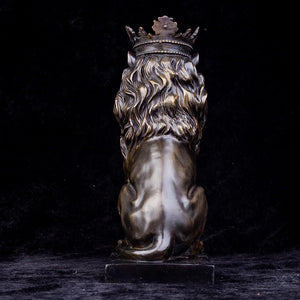 Front angle view of dark bronze crowned Lion King sitting statue against black background
