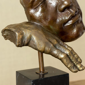 Close-up of abstract bronze face detail on Deep Reflection thinker meditator sculpture