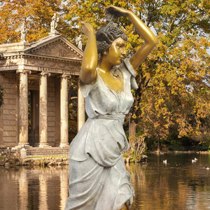 Demeter goddess bronze statue beside classical colonnade and reflecting pool as mythological garden art