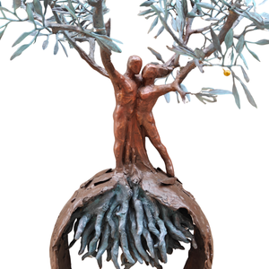 A high-detail close-up of the lower sphere and root structure of the handcrafted bronze olive tree and embracing couple sculpture, showcasing the complex root systems and the hanging golden water droplet.