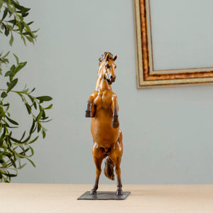 Gold bronze rearing stallion desk edition sculpture front view with greenery decor