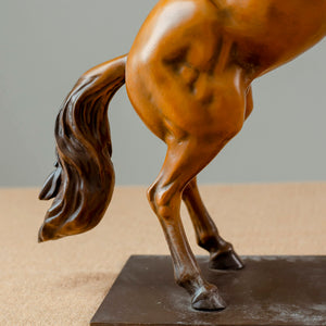 Gold bronze rearing stallion desk edition sculpture full body view on wooden desk showing tail