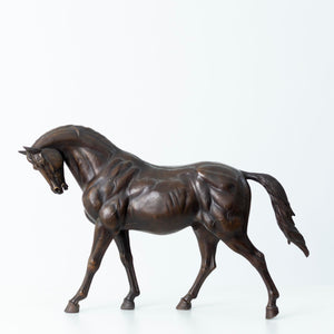 European Andalusian horse bronze sculpture in black finish, walking stallion side view on white background