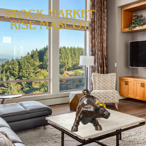 Classic brown bronze charging bull statue displayed on an executive desk