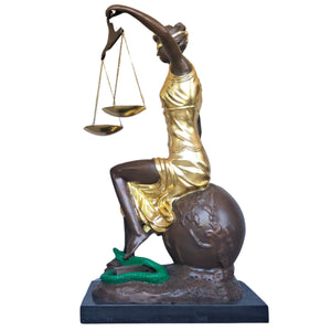 Back angle view of gilded pure bronze Lady Justice Themis statue on warm brown background