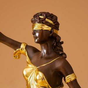 Back full body view of 28.3-inch gilded bronze Lady Justice Themis statue on warm brown background