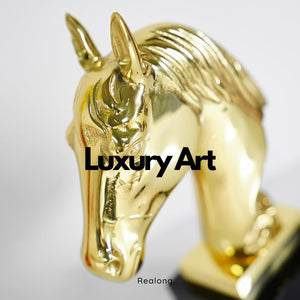 Close-up detail of gold brass horse head bust statue showing luxury art finish and facial detail