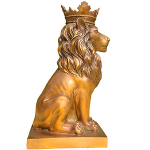 Back angle view of gold crowned Lion King sovereign sculpture showing crown and tail detail