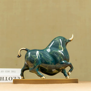Green Wall Street bull sculpture displayed on executive office desk.