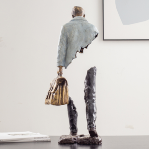 Greyish white voyageur bronze sculpture styled as luxury art decor.