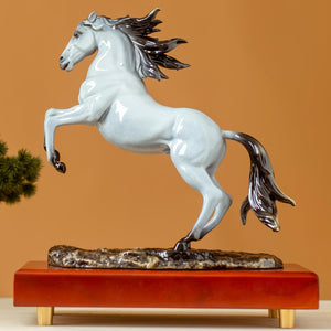 Second front view of pearl white rearing horse bronze sculpture on wood base